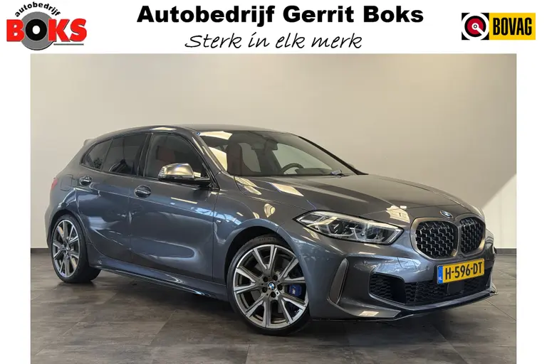 BMW 1-serie M135i xDrive High Executive Edition 306PK Headup Display Sportuitlaat Navigatie PDC VCP Cruise Control 19LMV  Volleder interieur Schaal stoelen afbeelding 1